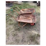 Two rustic wheel barrows
