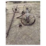 Three metal wheels with some parts