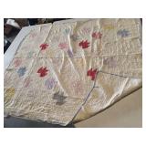 Vintage handmade patchwork quilt featuring a leaf pattern 76x67