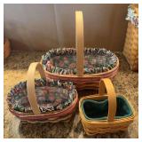 Two matching Longaberger baskets w protectors and liners, another basket w liner