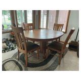 Oak pedestal dining table 48x60 w (2) self storing 12” leaves and 4 tulip chairs