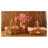 Three Longaberger breast cancer baskets