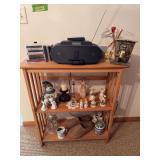 Shelf w tchotchkes, Galileo thermometer, wooden clogs, Sony stereo, etc
