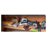Trailer hitches, jumper cables, grease guns, and box full of hammers