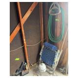 Small trike planter, lawn chairs, and hose