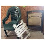2 plastic lawn chairs, 2 folding lawn chairs,and folding camp table