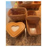 Three Longaberger baskets, divided basket has protectors and heart has a liner