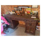 Desk and assorted items on wall
