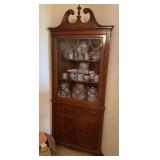 Corner hutch w single glass front door, lower double doors and a single drawer 16D x 32L x 77H