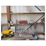 Misc tools on wall, drop cord and Tonka truck