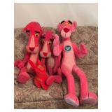 Three Pink Panther stuffies and a rabbit friend