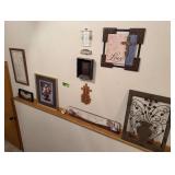 Wall decor on walls and ledge of front entry