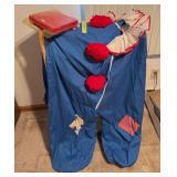 Someone’s clown suit and a quilt rack