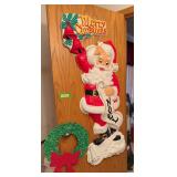Plastic 3d Santa and Merry Christmas sign, melted wreath