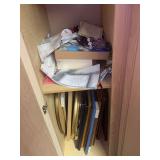 Comforters, blankets, mugs, picture frames and craft items in cabinets B