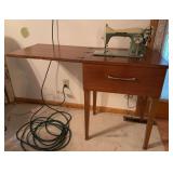 New Home sewing machine in cabinet