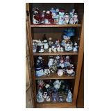 Snowmen and other Christmas decorations in display case