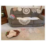 Several doilies in basket, many match