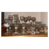 All glassware in and on entertainment center