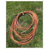 2 orange garden hoses