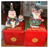 Three Crinkle Claus figurines