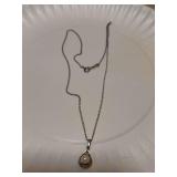 Sterling marked chain 18” and marked pendant