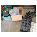 Water cans, plastic flower trays, and more gardening