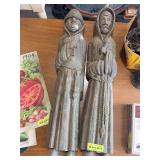 2 carved wooden statues