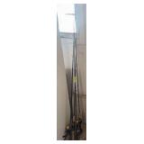 4 fishing poles and reels