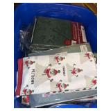18 gallon tote full of tablecloths, most appear new