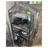 Five foot plastic covered green house with grow light, cords, heat mat, trays