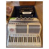 Noble Aerolite accordion and half of another accordion