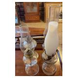 Four clear glass oil lamps