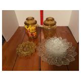 Berry bowl set and two amber glass humidors? One has match books in it