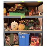 Three shelves of holiday decor