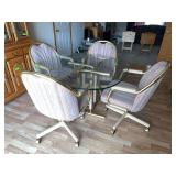 44” glass topped dining table w gold & wood pedestal base and four rolling chairs