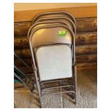 Four Samsonite padded seat folding chairs