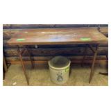 Wood topped folding table, may have gotten wet, there is separation of layers on right side