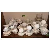 Uncounted, unsorted Homer Laughlin Georgian egg shell china, some is gold edged and some isn’t