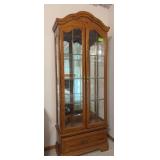 Lighted, mirrored back display case with double glass front doors, glass sides and single door 13D x 28L x 78H