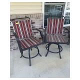 Two swivel patio stools