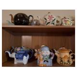 Two shelves of tea pots