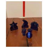 Blue sun/moon/star votive holder, blue sphere and two blue eyewash cups?