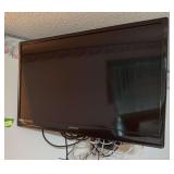 Magnavox 32” flatscreen tv w remote, has base and wall mount BRING TOOLS AND LADDER TO GET DOWN