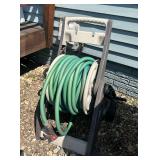 Garden hose and reel, Seller believes there is at least 60