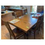 Dining table and 6 chairs 42x80 with 22” self storing leaf