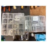 Two plastic containers of various dies
