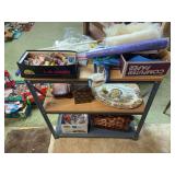 Small metal shelf with basket, turkey platter, thread, work gloves, dusters