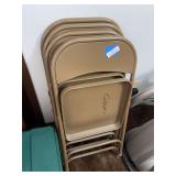 Four metal folding chairs