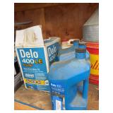 Four full gallons and extra Delo 15 W 40in shed by camper